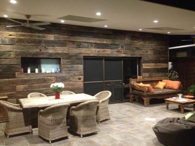 Timber feature wall in living room by Northern Rivers Recycled Timber - Weathered Face Sleeper panels