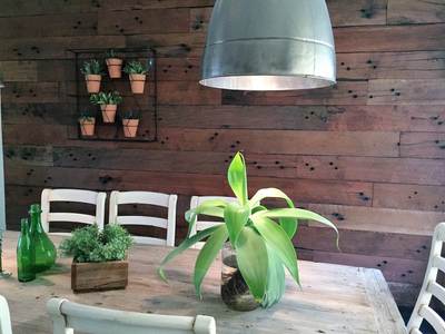 Timber feature wall in living room by Northern Rivers Recycled Timber - Rough Sawn Sleeper panels