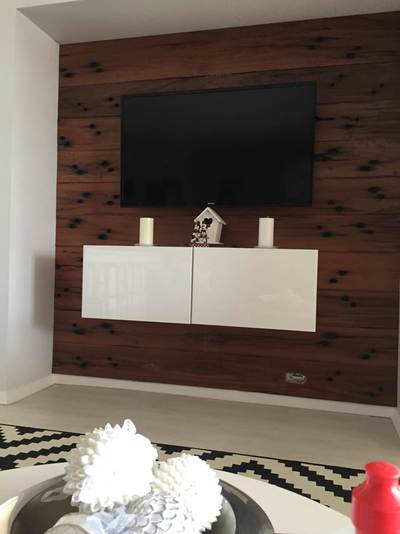 Timber feature wall in living room by Northern Rivers Recycled Timber - V-Groove Sleeper panels