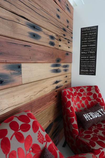 Timber feature wall in living room by Northern Rivers Recycled Timber - V-Groove Sleeper panels