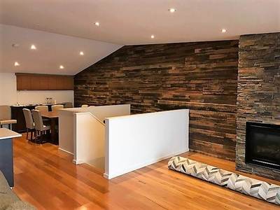 Timber feature wall in living room by Northern Rivers Recycled Timber - Artisan two board panels
