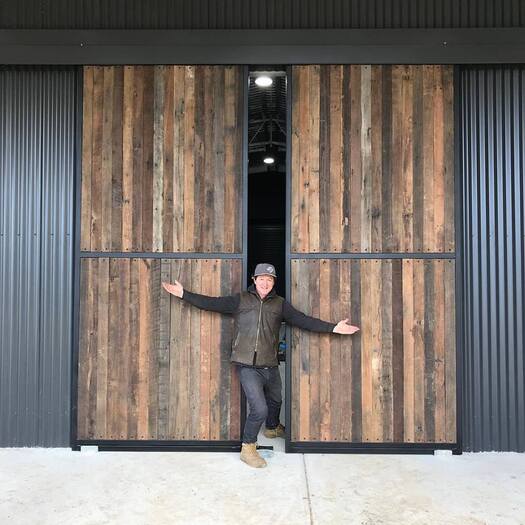 Wire brushed hardwood cladding barn door