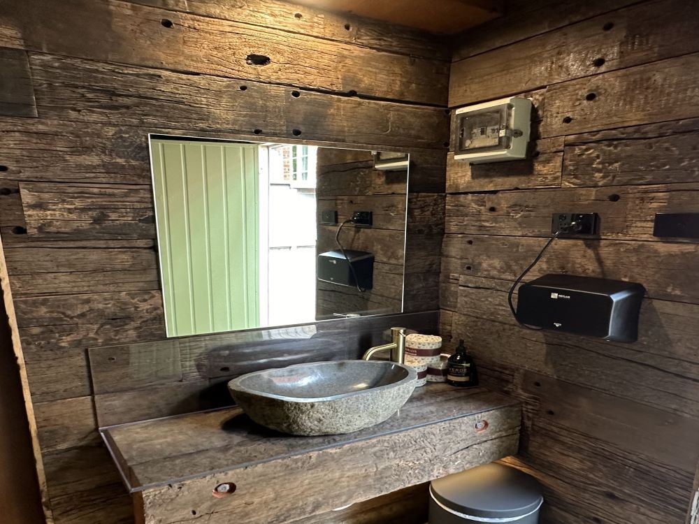 Rustic bathroom with railway sleepers