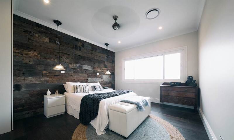 Timber feature walls in a bedroom - Weathered face sleeper panels by Northern Rivers Recycled Timber