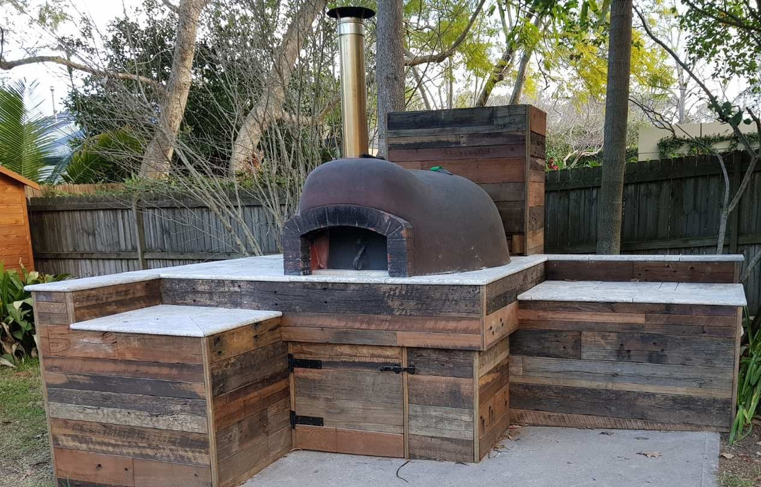 recycled timber around pizza oven