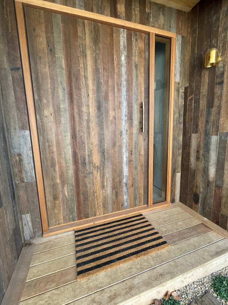 Recycled hardwood wall cladding front door